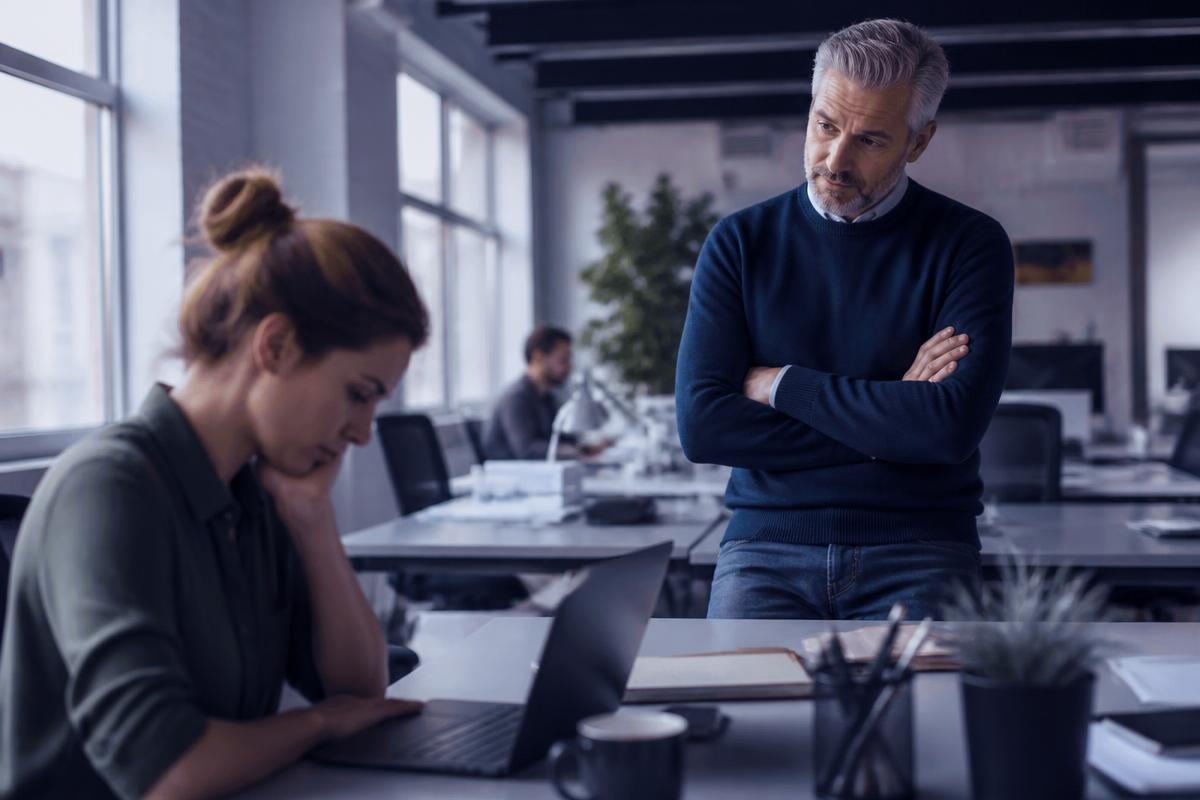 A manager listening carefully to a team member during a quiet check in conversation